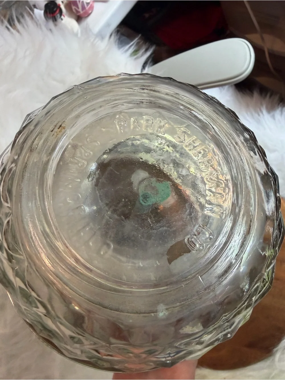 A vintage Park Sherman chrome and glass liquor dispenser with a metal tray.